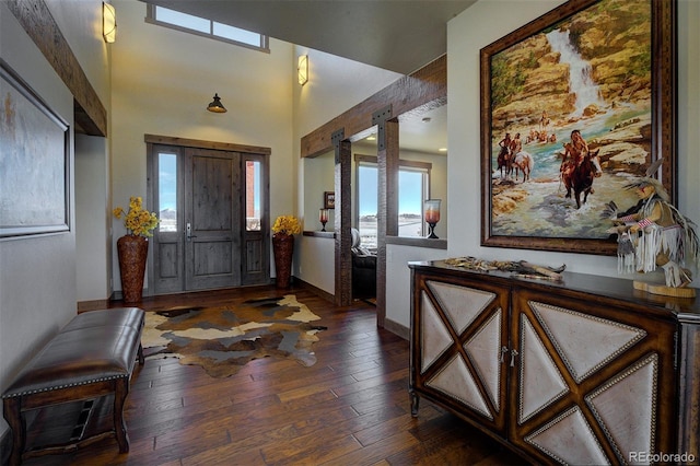 entryway with dark hardwood / wood-style floors