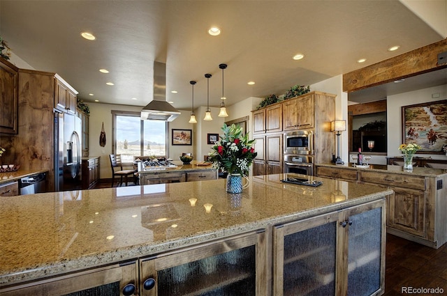 kitchen featuring beverage cooler, appliances with stainless steel finishes, decorative light fixtures, island exhaust hood, and light stone counters