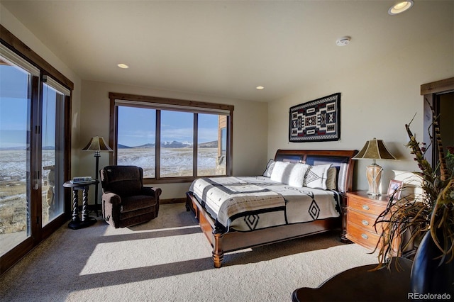 carpeted bedroom with a mountain view