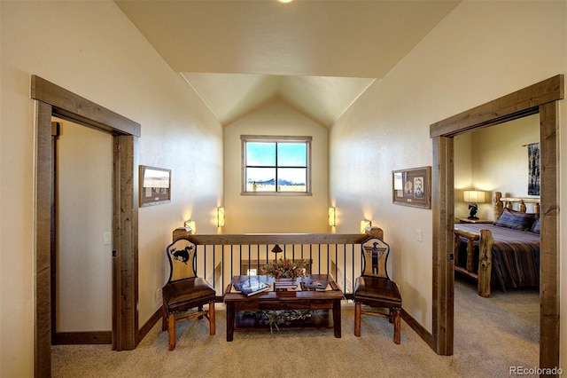 living area with carpet floors and vaulted ceiling