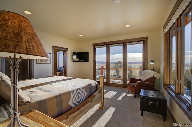 carpeted bedroom featuring access to exterior and french doors