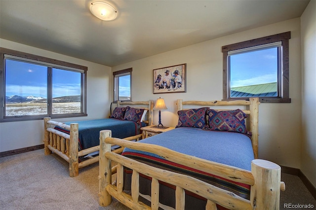 carpeted bedroom featuring a mountain view