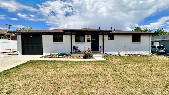7150 Beach St, Westminster, CO 80030 - view of front of property featuring brick siding, concrete driveway, and an attached garage