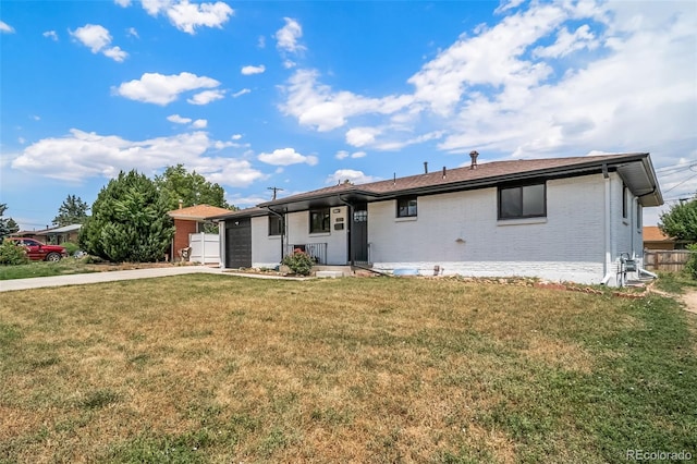 7150 Beach St, Westminster, CO 80030 - single story home with a garage, brick siding, and driveway