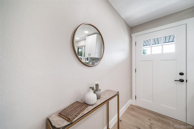 7150 Beach St, Westminster, CO 80030 - entryway featuring light wood finished floors and baseboards