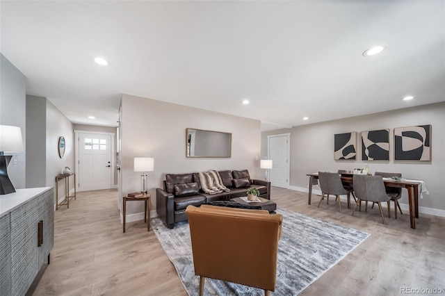 7150 Beach St, Westminster, CO 80030 - living area featuring light wood finished floors and recessed lighting