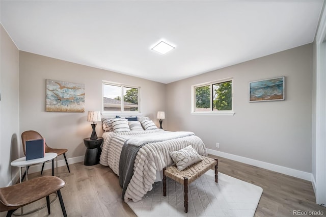 7150 Beach St, Westminster, CO 80030 - bedroom with multiple windows and light wood-type flooring