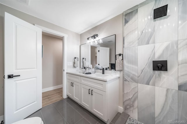 7150 Beach St, Westminster, CO 80030 - full bathroom featuring double vanity, walk in shower, and tile patterned flooring