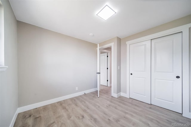 7150 Beach St, Westminster, CO 80030 - unfurnished bedroom with light wood-style floors and a closet