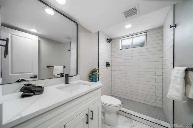 7150 Beach St, Westminster, CO 80030 - bathroom with vanity, recessed lighting, marble look tiles, and tiled shower