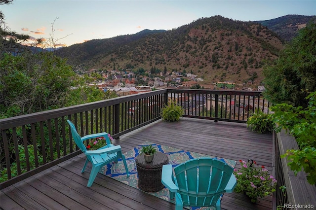 deck at dusk with a mountain view