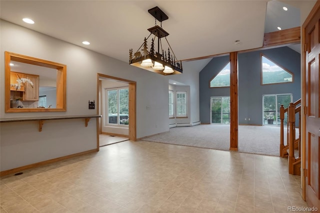 interior space with a baseboard radiator and high vaulted ceiling