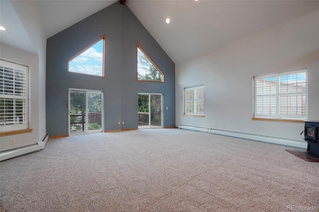 unfurnished living room featuring a baseboard heating unit, beam ceiling, high vaulted ceiling, carpet floors, and a wood stove