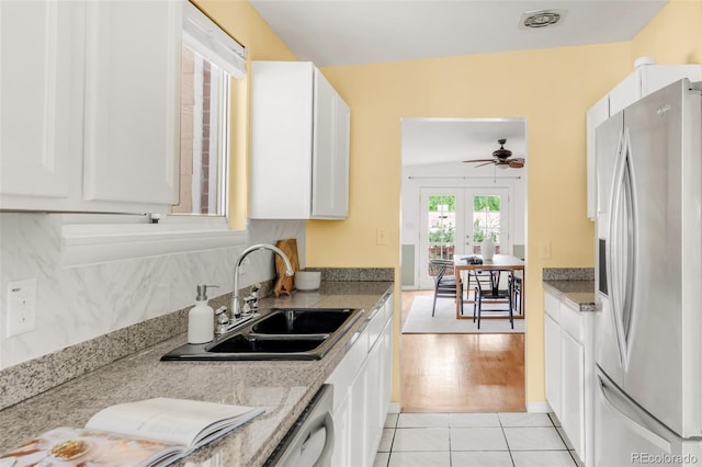 6535 Balsam St, Arvada, CO 80004 - kitchen with stainless steel fridge with ice dispenser, a sink, white cabinets, and a ceiling fan