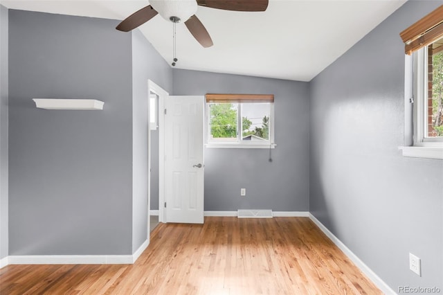 6535 Balsam St, Arvada, CO 80004 - spare room with wood finished floors, ceiling fan, and baseboards