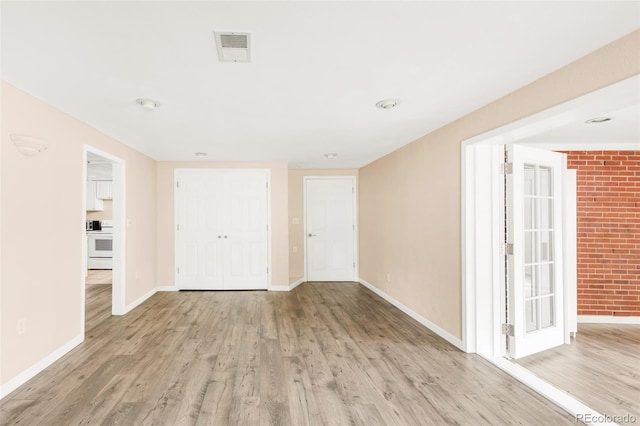 6535 Balsam St, Arvada, CO 80004 - foyer with wood finished floors and baseboards