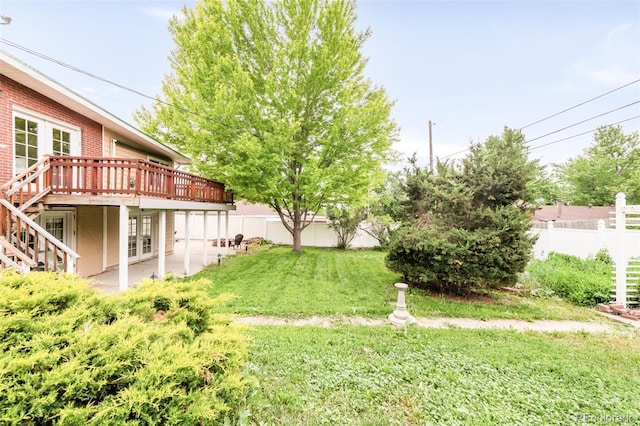 6535 Balsam St, Arvada, CO 80004 - view of yard with a deck, a patio area, french doors, and stairs
