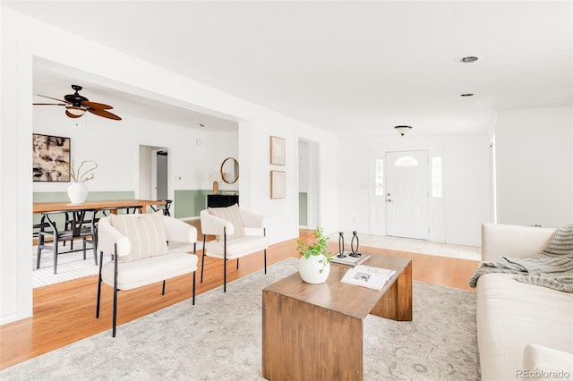 6535 Balsam St, Arvada, CO 80004 - living area with light wood finished floors and ceiling fan