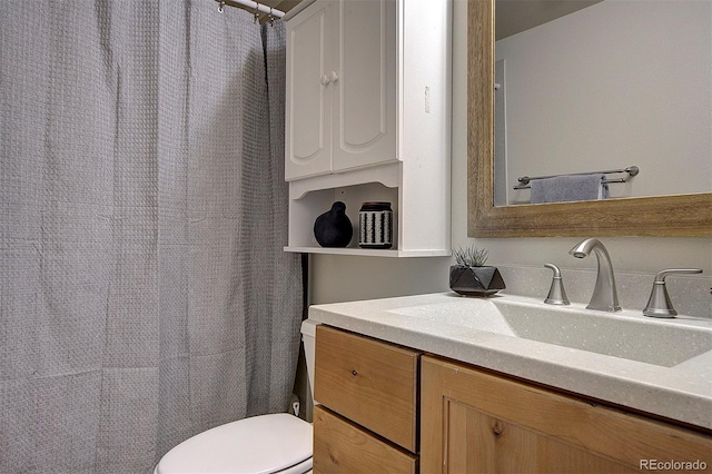 11669 S Upper Ranch Dr, Pine, CO 80470 - bathroom with vanity, toilet, and a shower with curtain