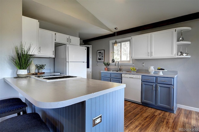 11669 S Upper Ranch Dr, Pine, CO 80470 - kitchen featuring white appliances, open shelves, a peninsula, a kitchen bar, and blue cabinetry