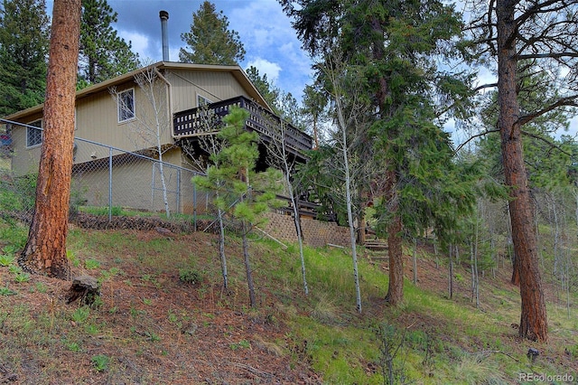 11669 S Upper Ranch Dr, Pine, CO 80470 - view of side of home with a deck