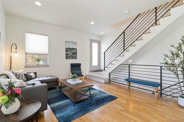 2409 Court Pl, Denver, CO 80205 - living room featuring recessed lighting, wood finished floors, and stairway