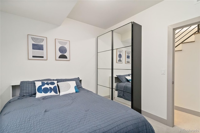 2409 Court Pl, Denver, CO 80205 - bedroom featuring baseboards and light carpet