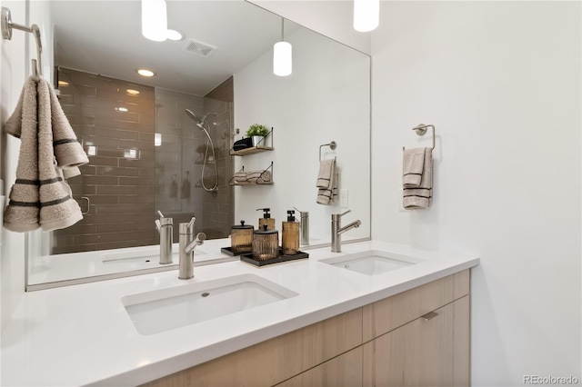 2409 Court Pl, Denver, CO 80205 - bathroom with a sink, a shower stall, and double vanity