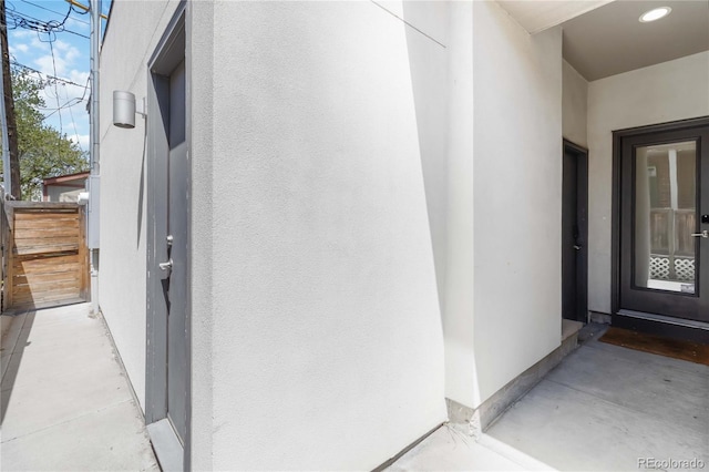 2409 Court Pl, Denver, CO 80205 - doorway to property with fence and stucco siding