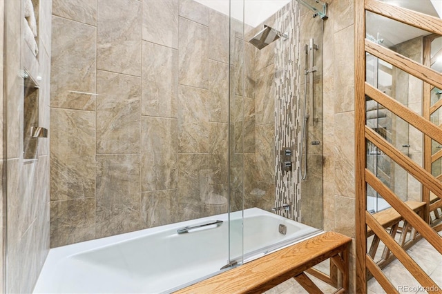 bathroom featuring tile walls and enclosed tub / shower combo