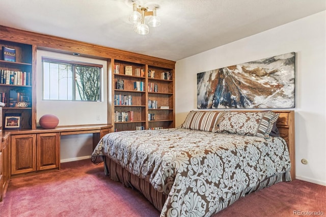 carpeted bedroom with baseboards