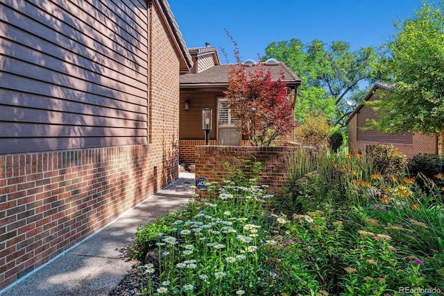 view of home's exterior featuring brick siding