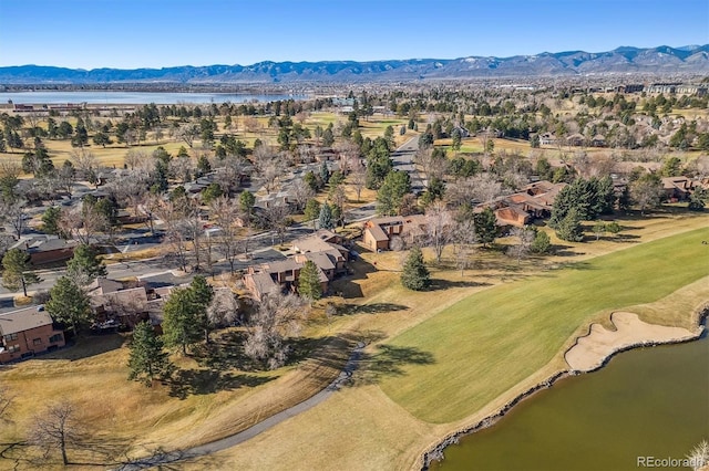 birds eye view of property with a water and mountain view