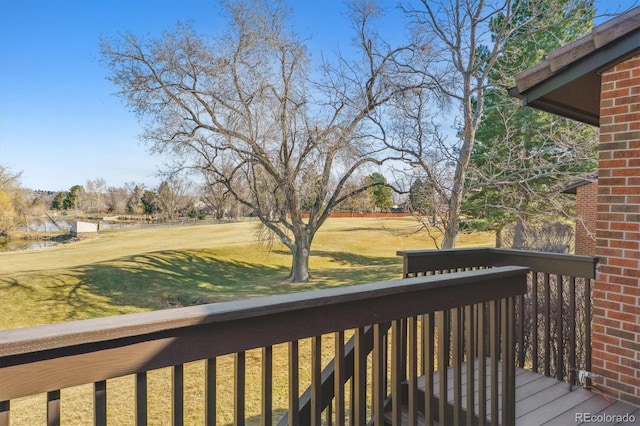 wooden terrace with a yard