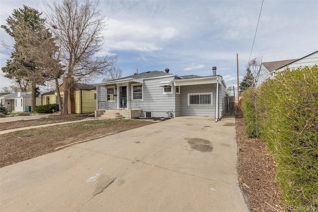 1945 Nome St, Aurora, CO 80010 - view of front of house featuring driveway, fence, and central AC