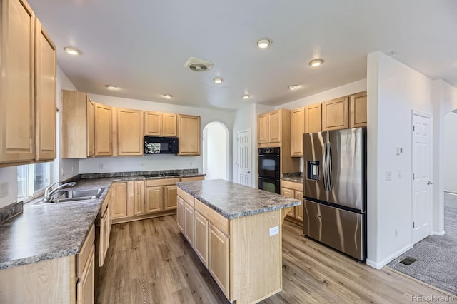 24763 E Crestridge Pl, Aurora, CO 80016 - kitchen featuring arched walkways, black appliances, and light brown cabinets