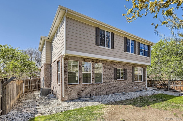 24763 E Crestridge Pl, Aurora, CO 80016 - exterior space featuring brick siding, central AC unit, and a fenced backyard