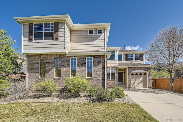 24763 E Crestridge Pl, Aurora, CO 80016 - traditional home with concrete driveway, brick siding, fence, and a garage