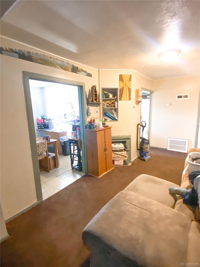 carpeted living room featuring visible vents