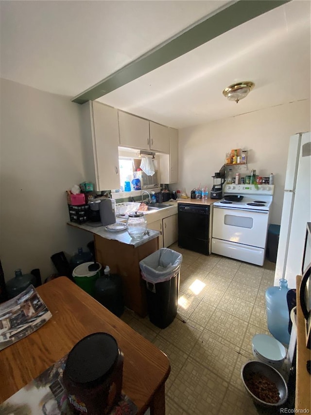 kitchen featuring white appliances, light countertops, a sink, and light floors