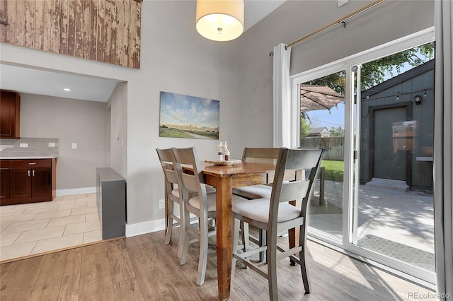 dining area with light hardwood / wood-style floors