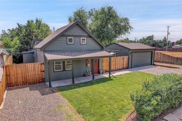 view of front facade with a garage and a front yard