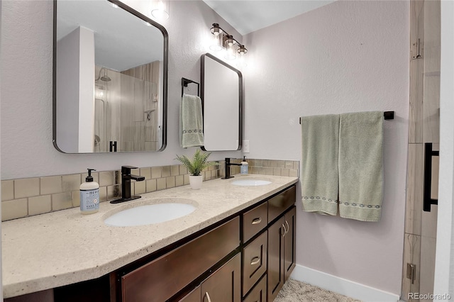 bathroom featuring vanity and decorative backsplash