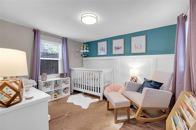 bedroom with a nursery area