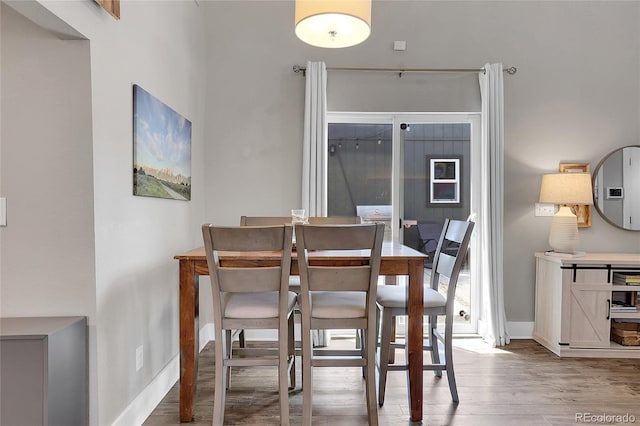 dining space featuring hardwood / wood-style flooring