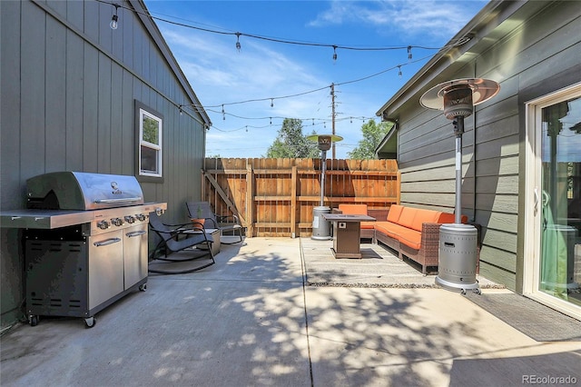 view of patio / terrace with an outdoor living space and a grill