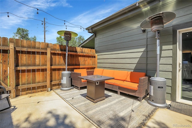 view of patio / terrace featuring an outdoor living space with a fire pit