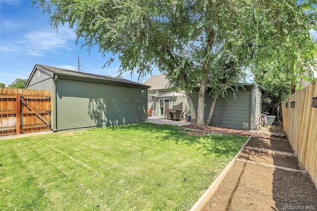 rear view of house featuring a storage unit and a lawn