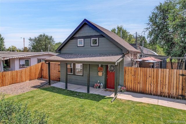 view of front of home featuring a patio area and a front lawn