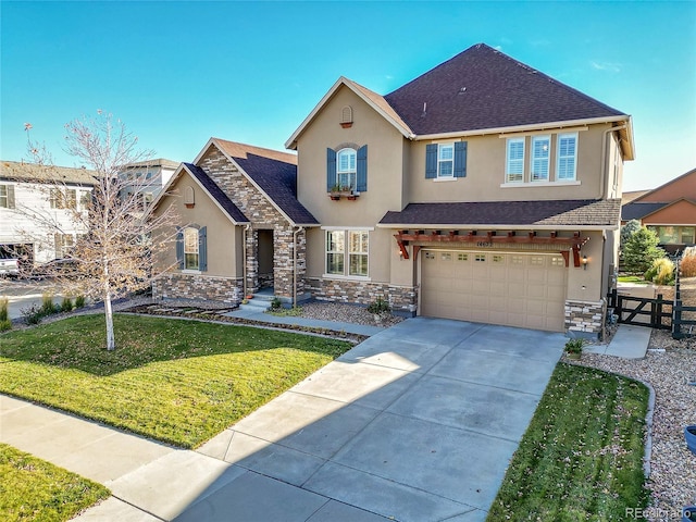 view of front of house with a garage and a front yard